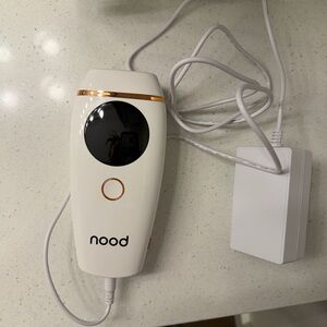 nood White and Rose Gold Handheld Electronic Device with Charger